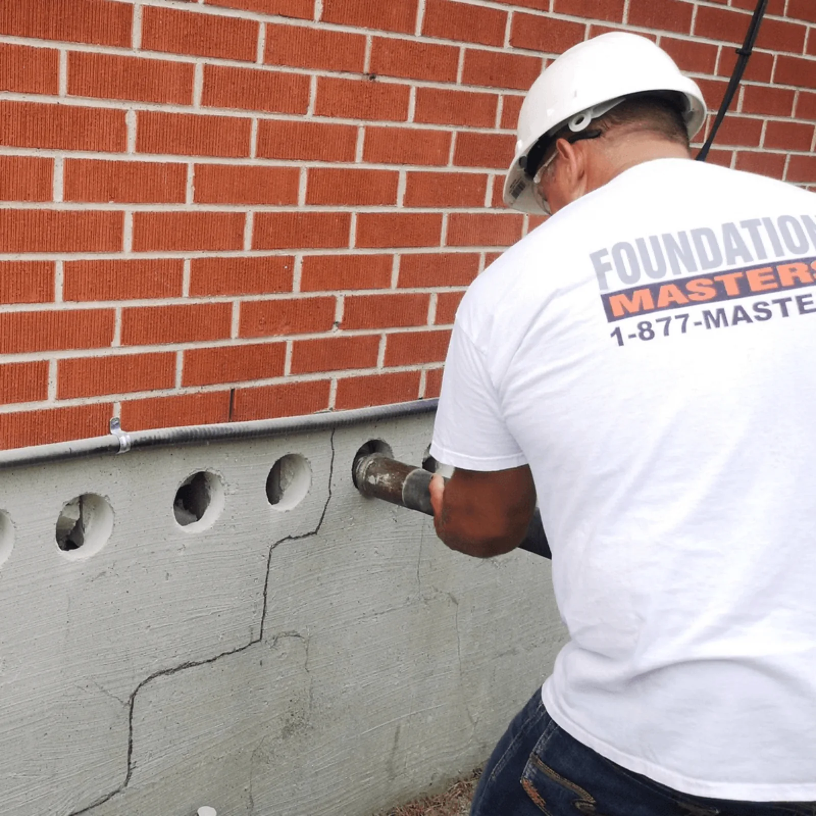 Core-fill foundation repair process — concrete grout filling block cavity