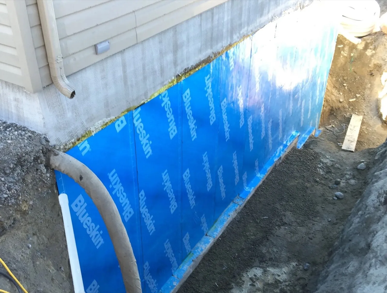 Foundation waterproofing membrane installation